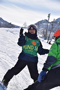 Mitu-san enjoying skiing on the snow-covered slopes during the ski training program.